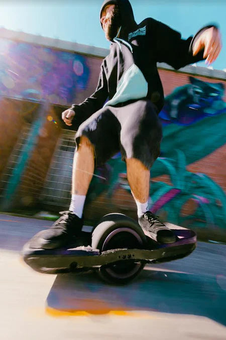 Rider Riding a Onewheel GT with WTF Rails